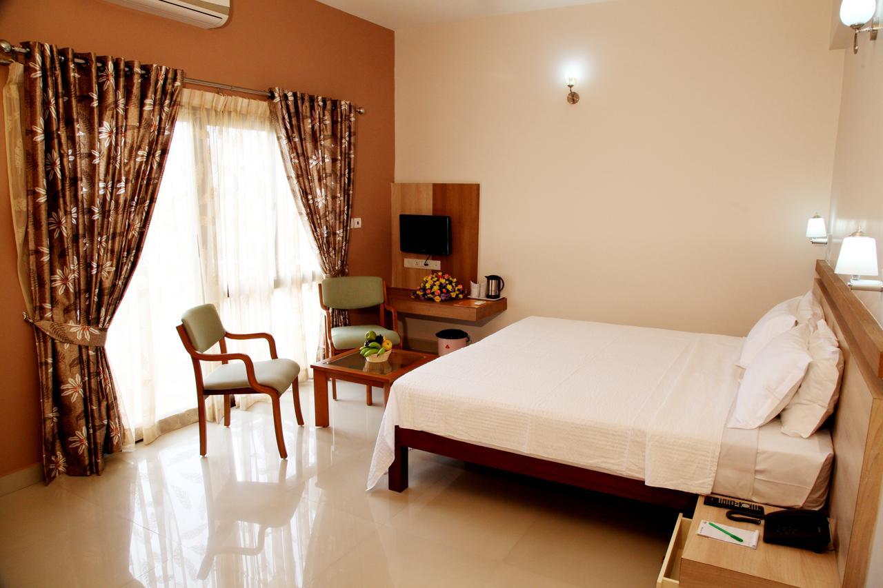 Hotel Polariz Parassinikkadavu Quarto foto